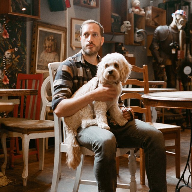 Graham Ormiston, with Archie the dog on his lap